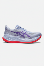 Gray running shoes with purple logo and red soles on a white background
