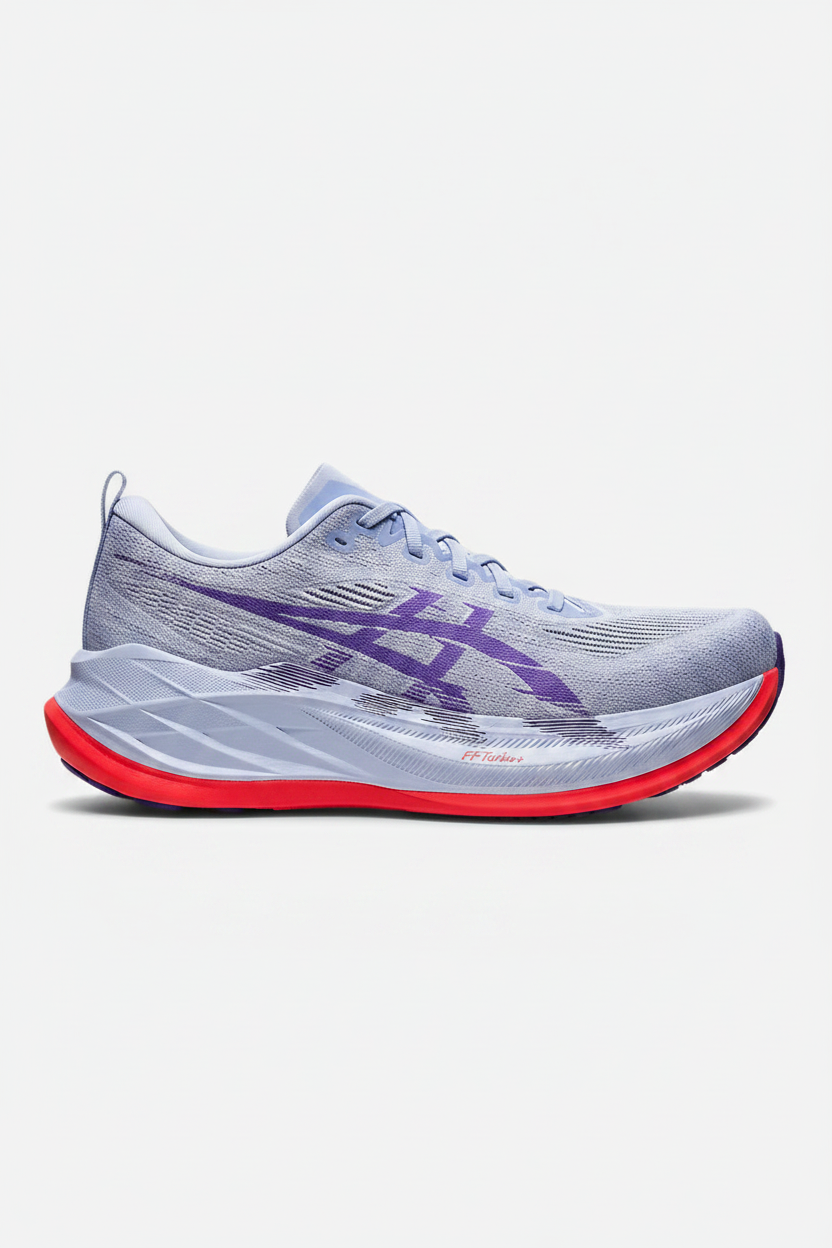 Gray running shoes with purple logo and red soles on a white background