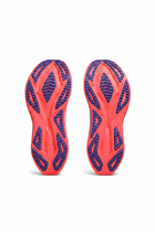 Red and blue athletic shoe sole on a white background