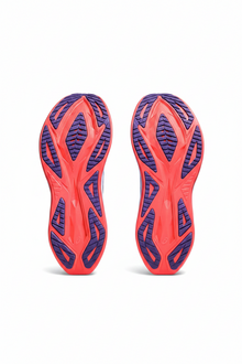 Red and blue athletic shoe sole on a white background